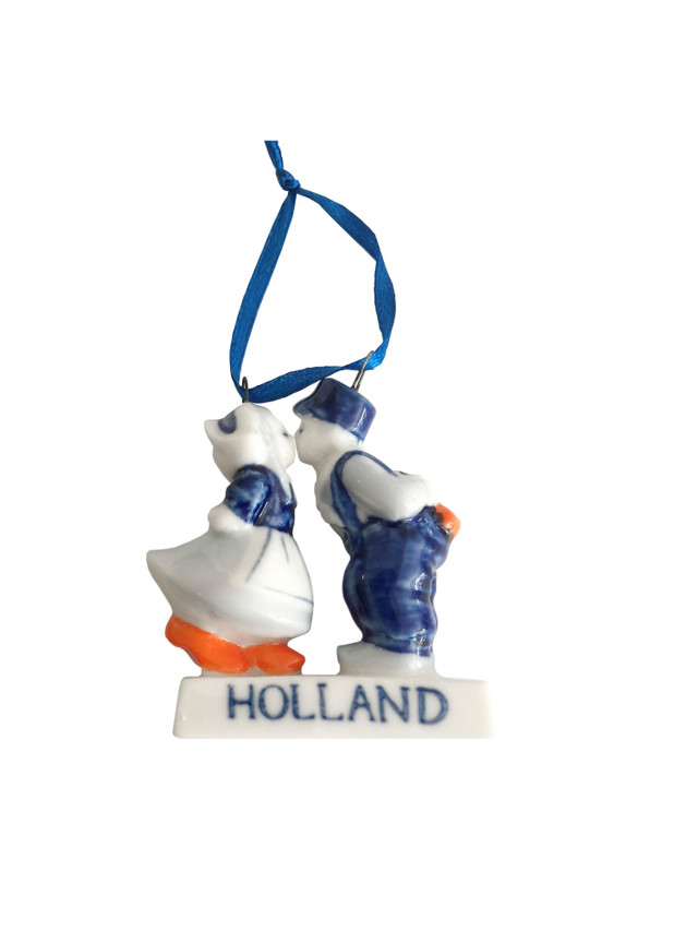 Eight shirts arranged on table in black, olive, grey, blue, white, red, mustard, and green.