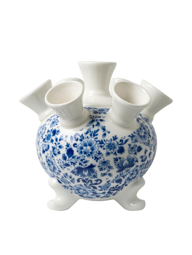 Windmill statue with decorative landscape design.