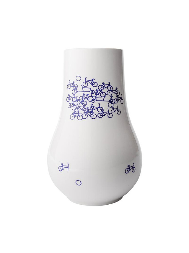 Eight shirts arranged on table in black, olive, grey, blue, white, red, mustard, and green.